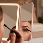 Pink trifold vanity mirror magnifying side panel close up