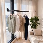 Suction clothes hanger drying shirts at a living room window in an apartment