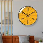 Modern Nordic wall clock with orange face above a sofa