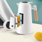 Thermal jug with temperature display on a table